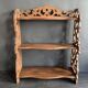 Antique shelf with openwork wooden pediment, early 20th century