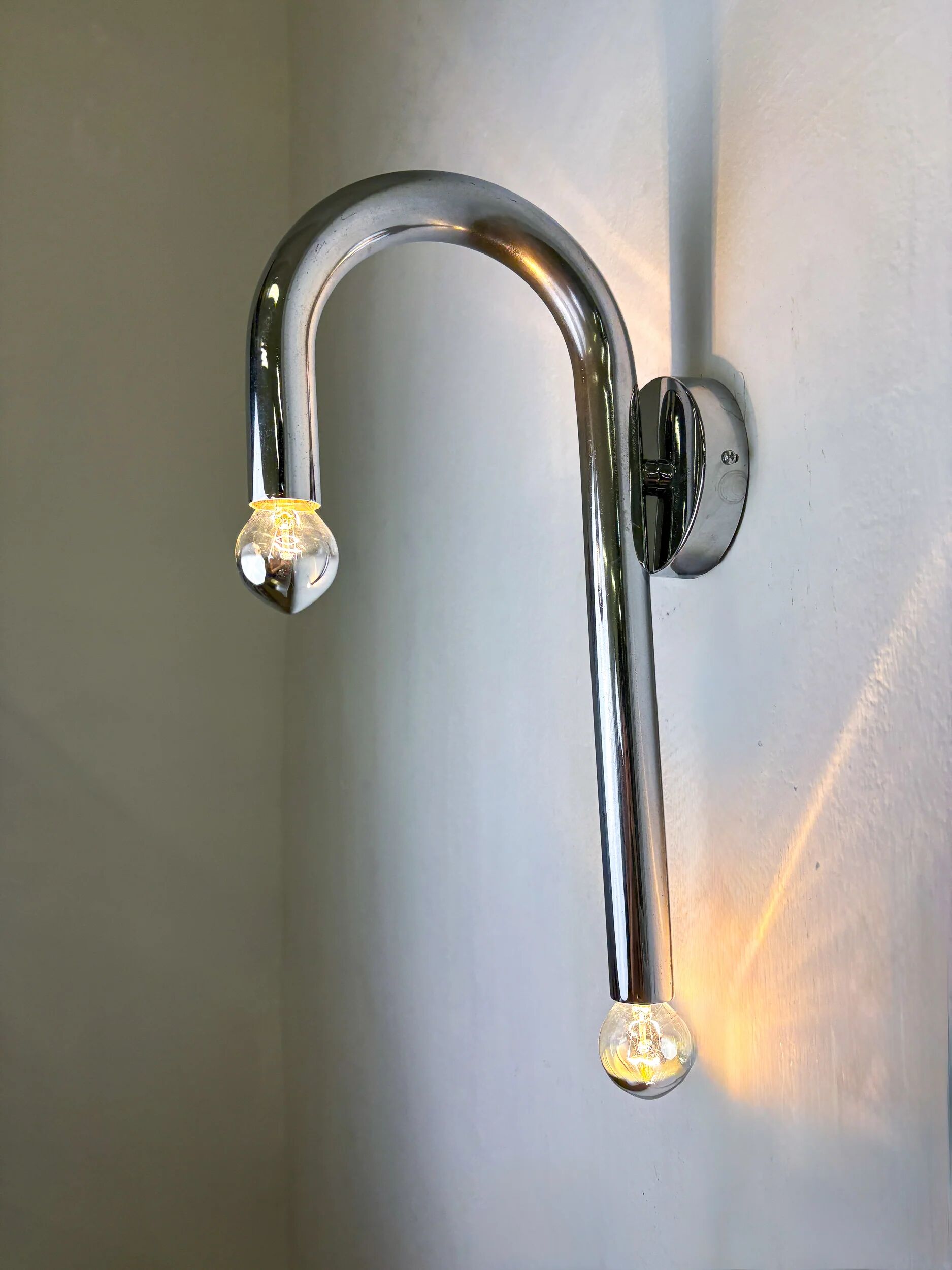 Pair of Space-Age tubular wall lights, chromed metal, Italy, 1970s