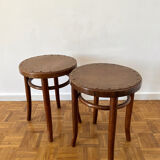 2 antique bistro stools with curved wood and caning effect.