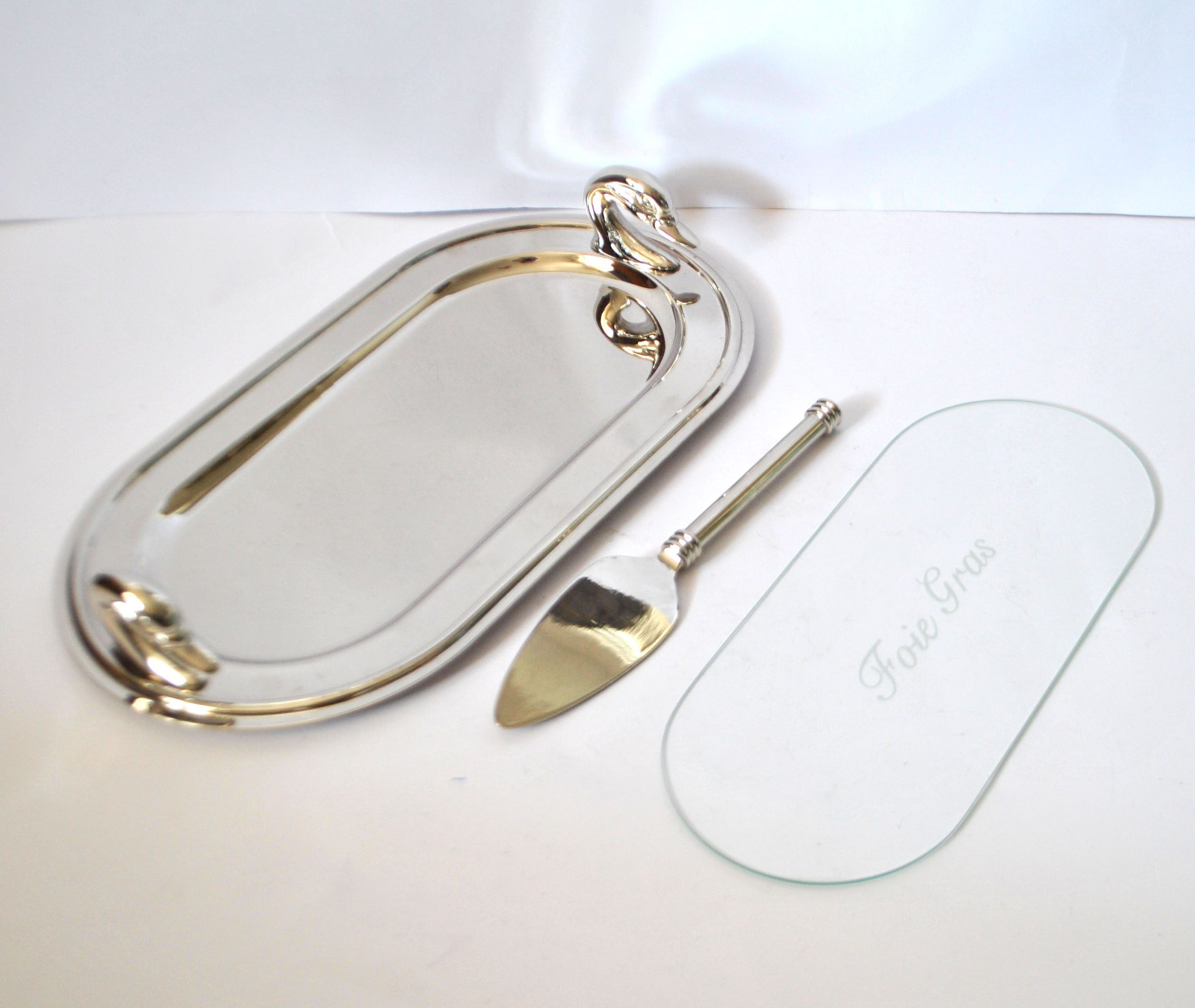 Vintage silver-plated foie gras platter with goose head decoration and serving spatula.