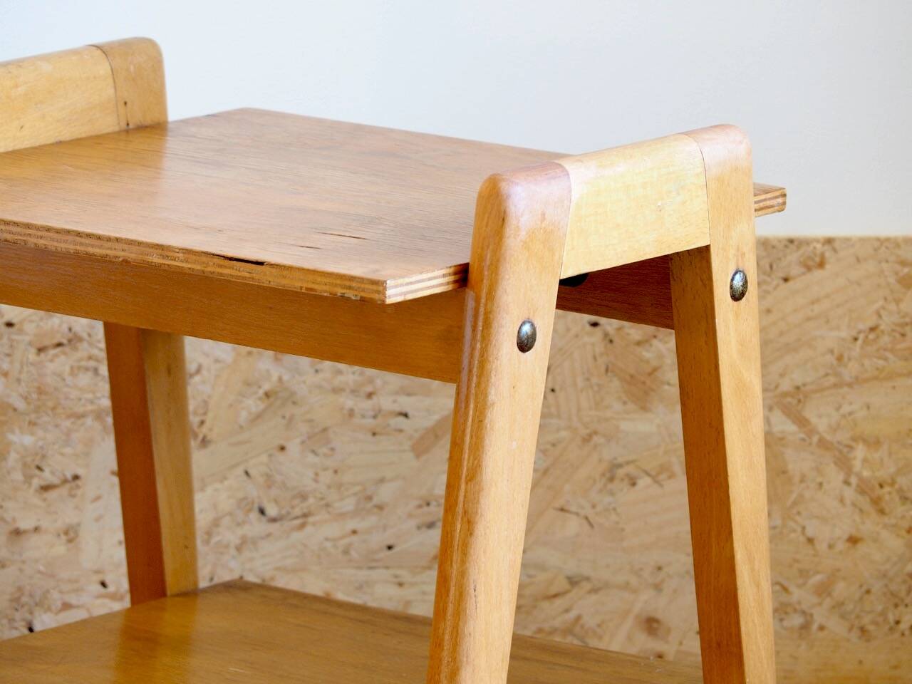 Bedside or side table with compass legs.