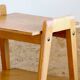Bedside or side table with compass legs.