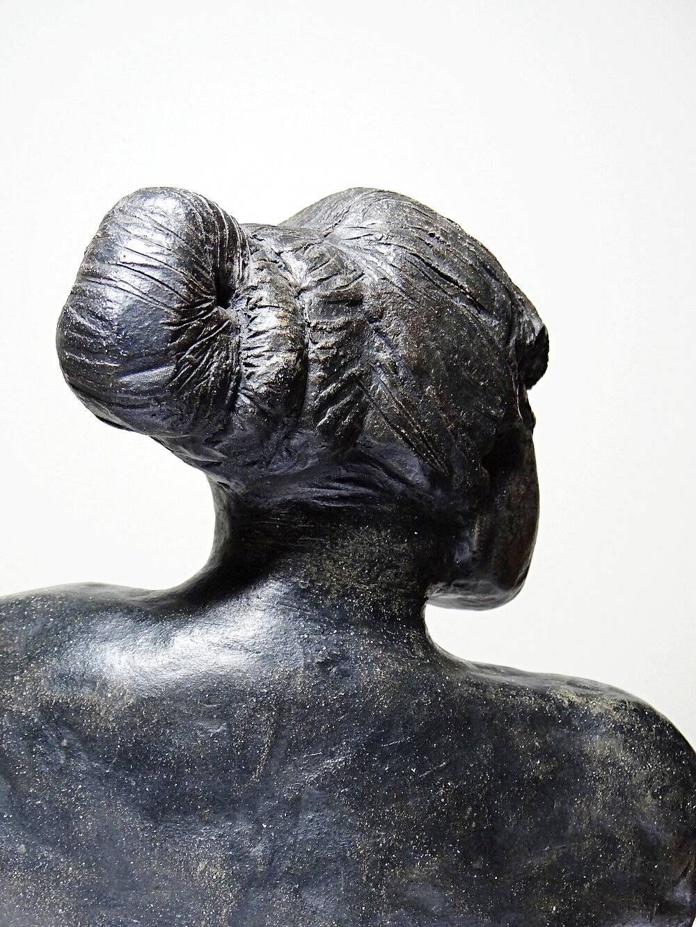 20th-century ceramic bust of a woman, an unidentified piece of art.