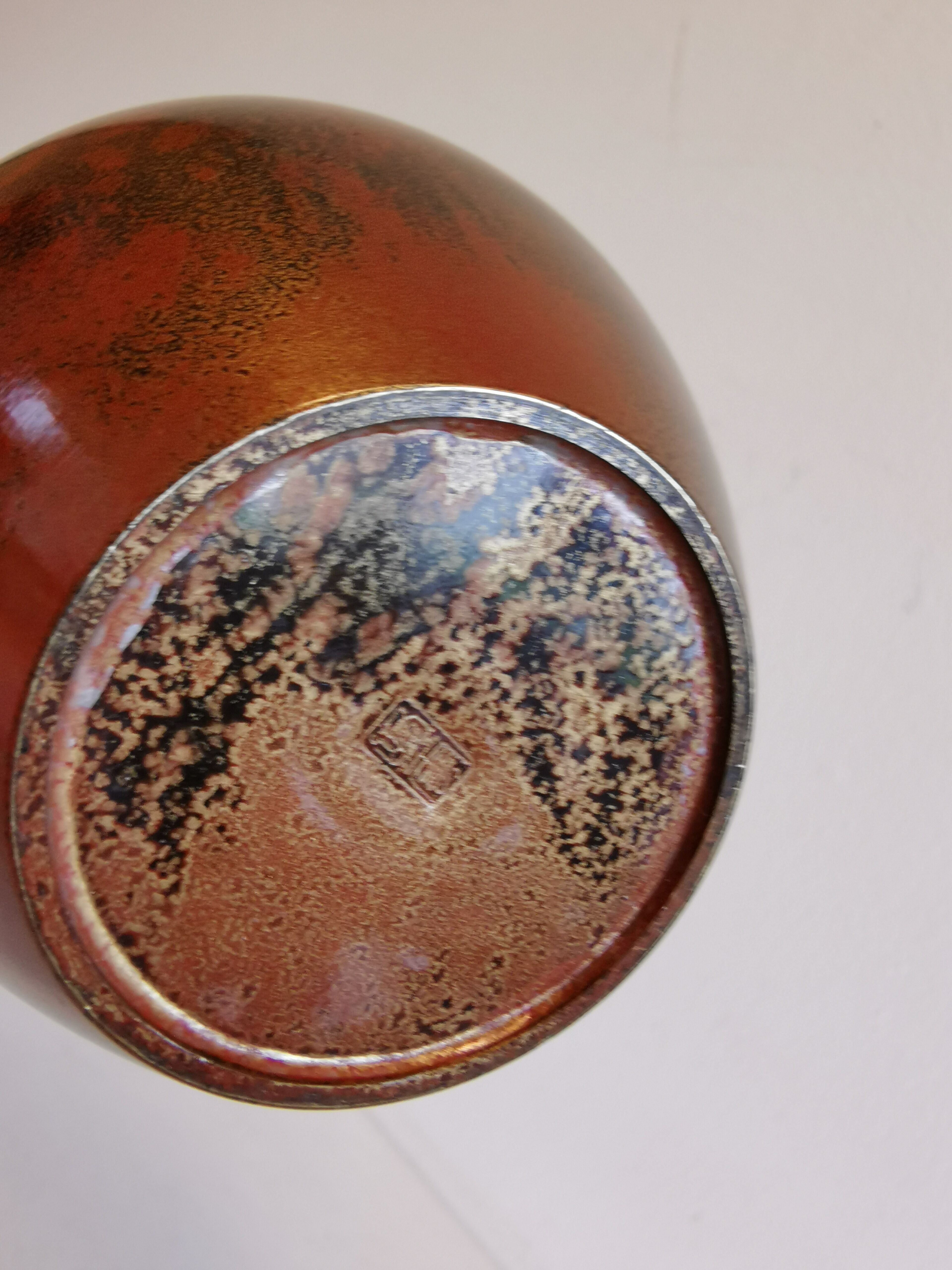 Slim vase with metallic finish.