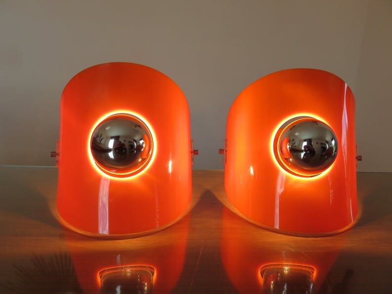 Pair of sconces in orange 70s perspex