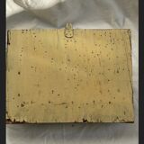 Hammered leather wall mail holder on wood.