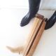 Old wooden shoe trees and their vintage leather rider boots. 1950