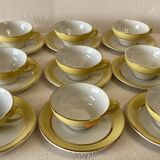 Yellow and white cups and saucers with gold trim Moulin des loups