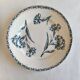 Two ironstone plates from Lunéville Keller and Guérin with a floral pattern.