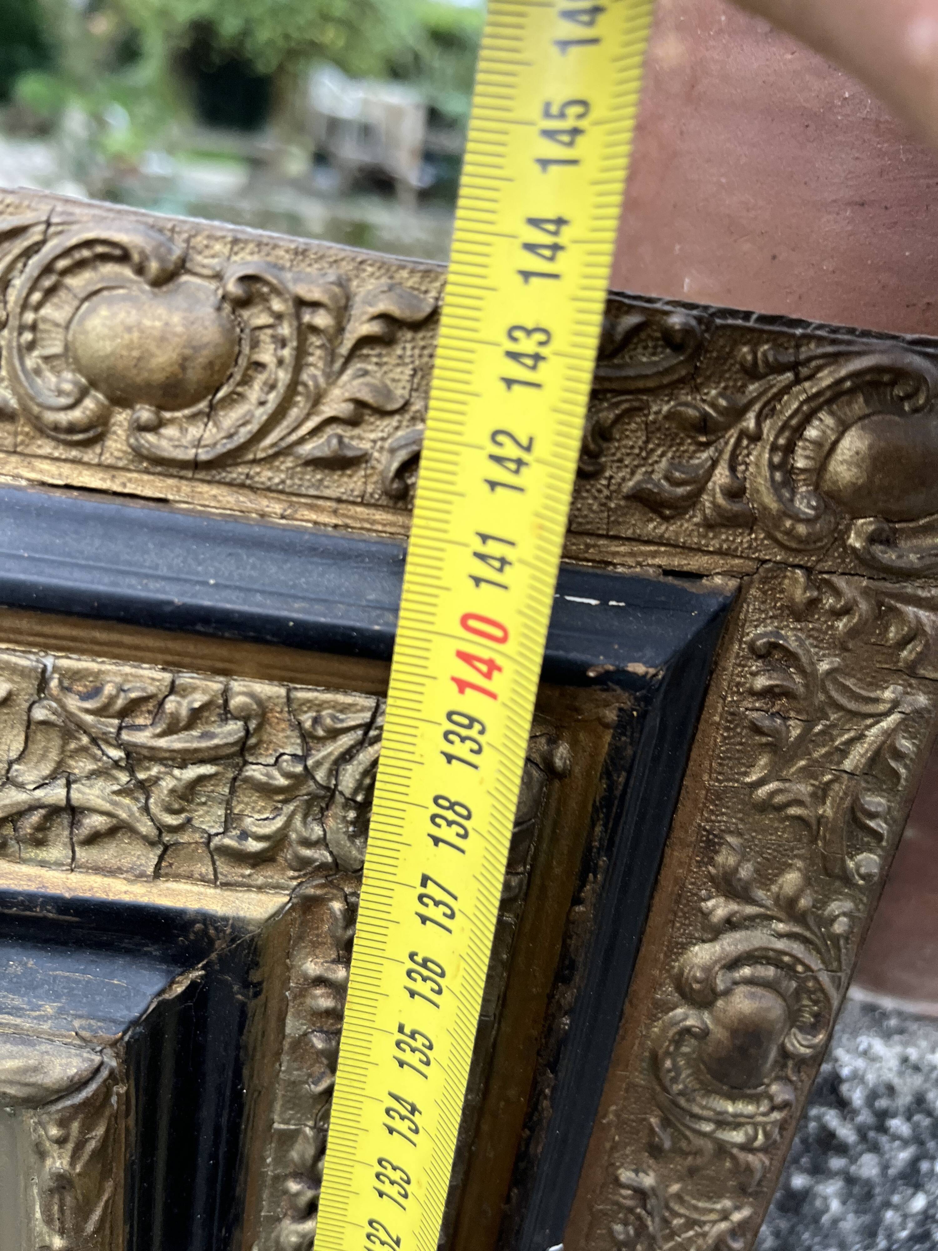 Large antique gilt mirror with scroll and shell decoration, 144 cm