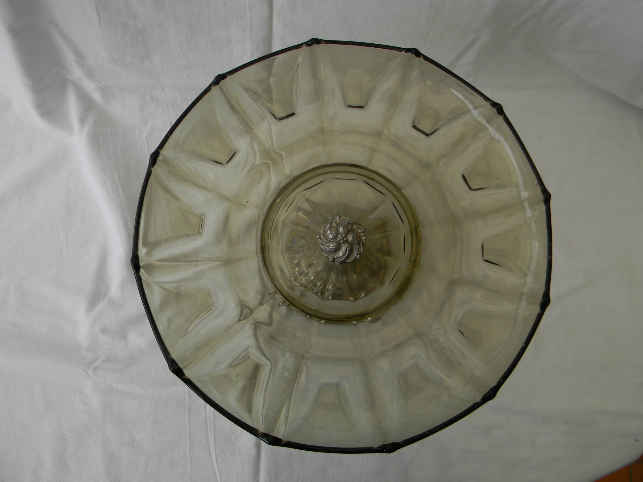 Large smoked glass fruit bowl with a metal base.