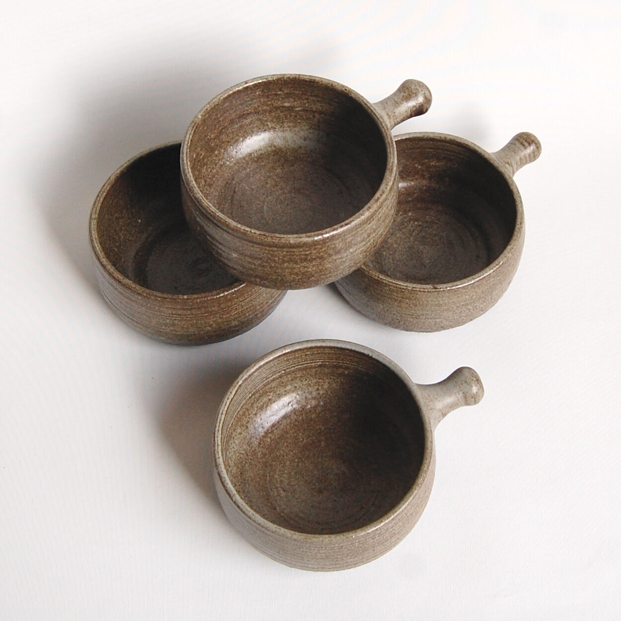 Set of 4 bowls and 4 plates by Thèrèse Bataille for the workshop of Dour 1970s