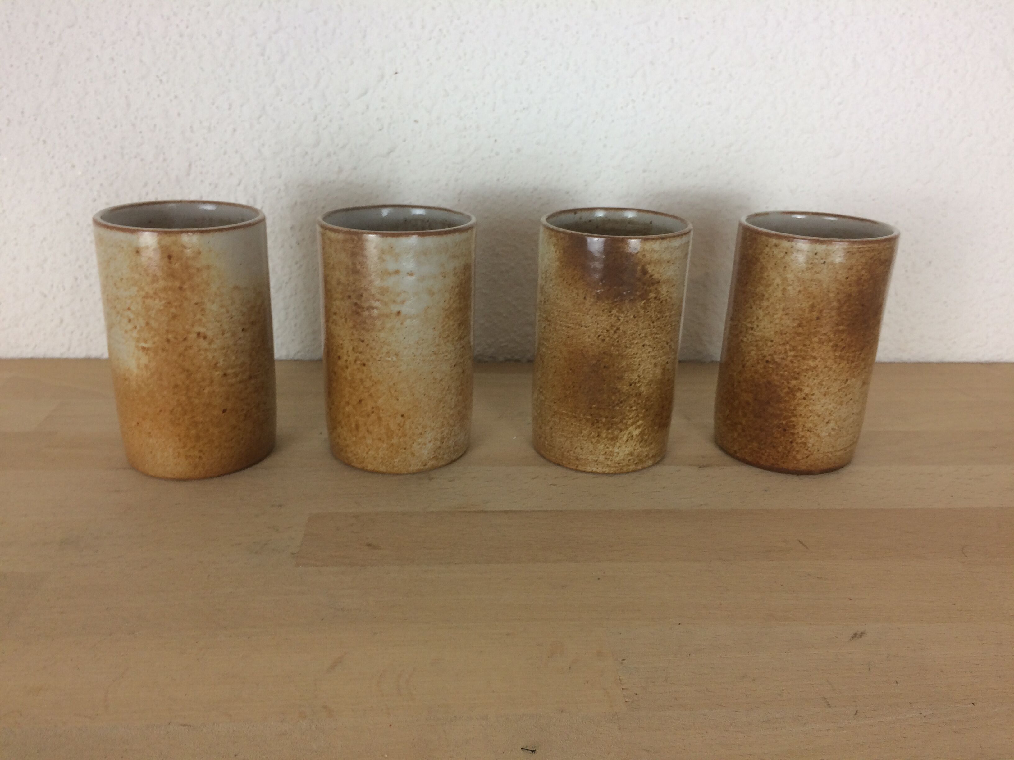4 signed sandstone cup glasses