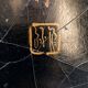 Antique Chinese coffee table in black and gold lacquered wood.