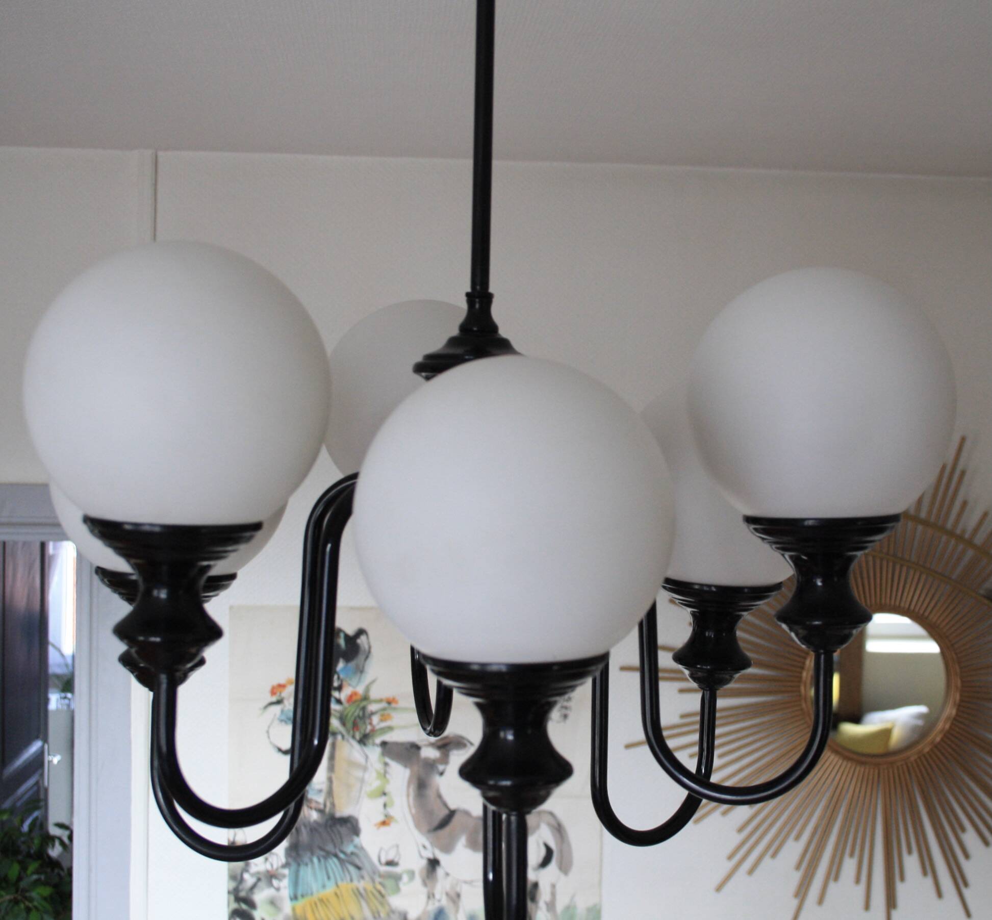 Metal chandelier and glass globes