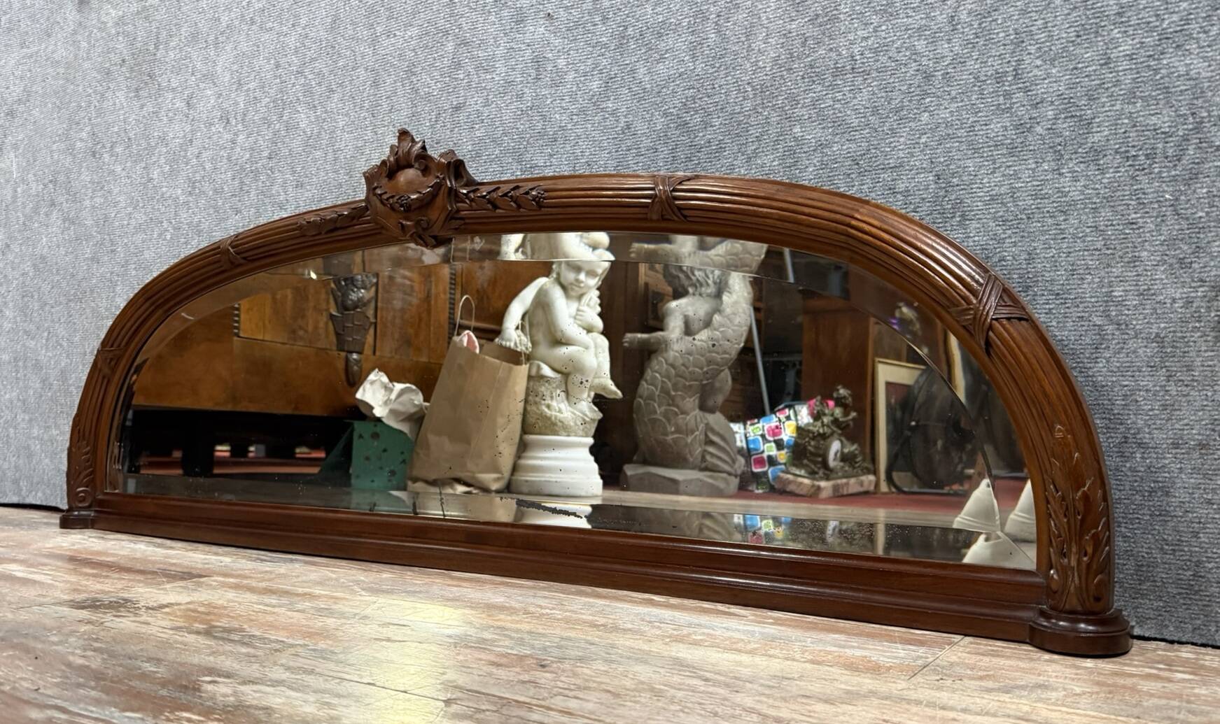 Very large Louis XVI style half-moon mirror in mahogany