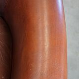 English style sheepskin club chair with a beautiful patina