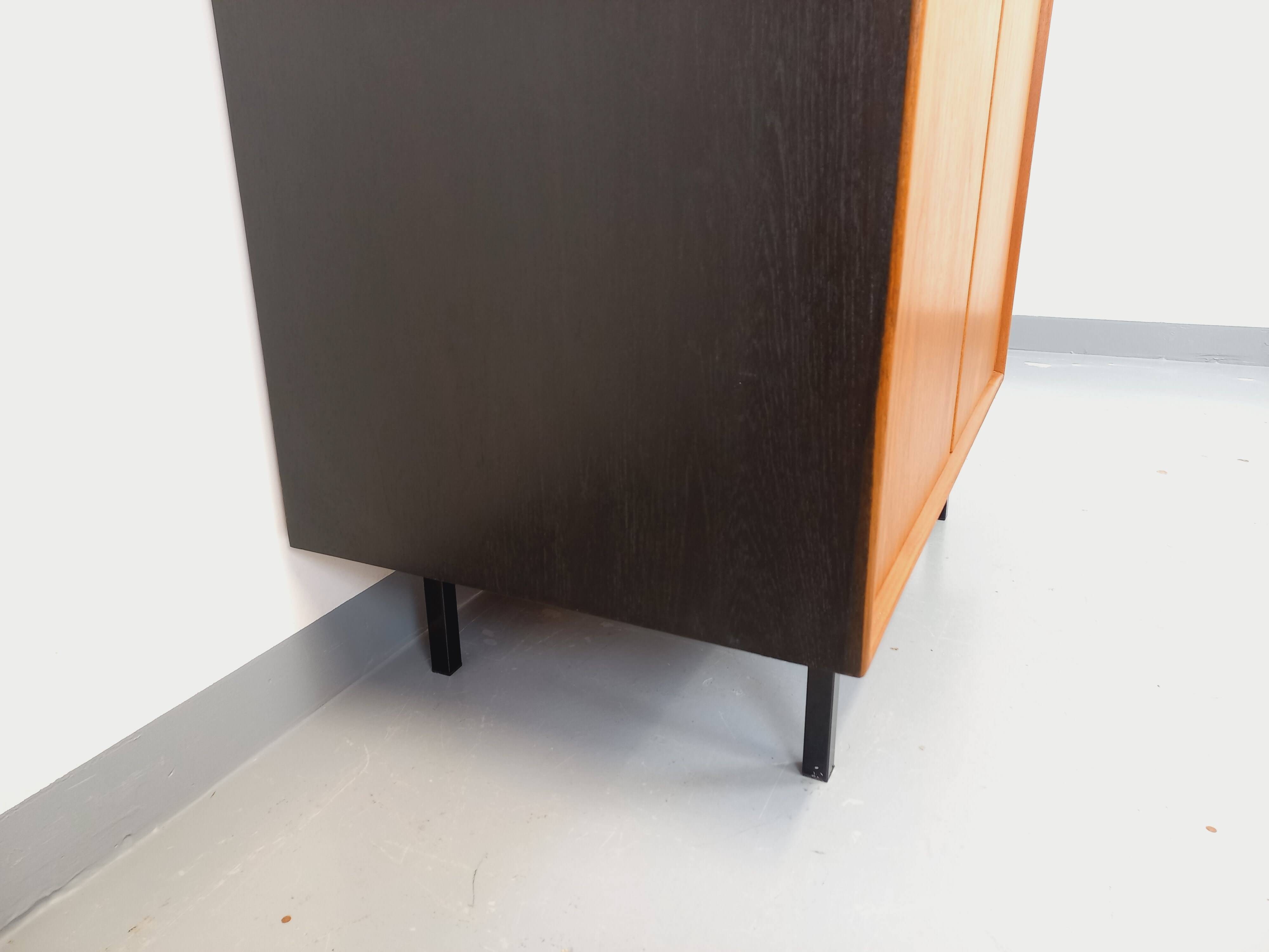 Vintage Scandinavian modernist wardrobe in teak and metal from the 1960s.