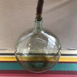 Former green glass demijohn