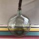 Former green glass demijohn