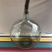 Former green glass demijohn