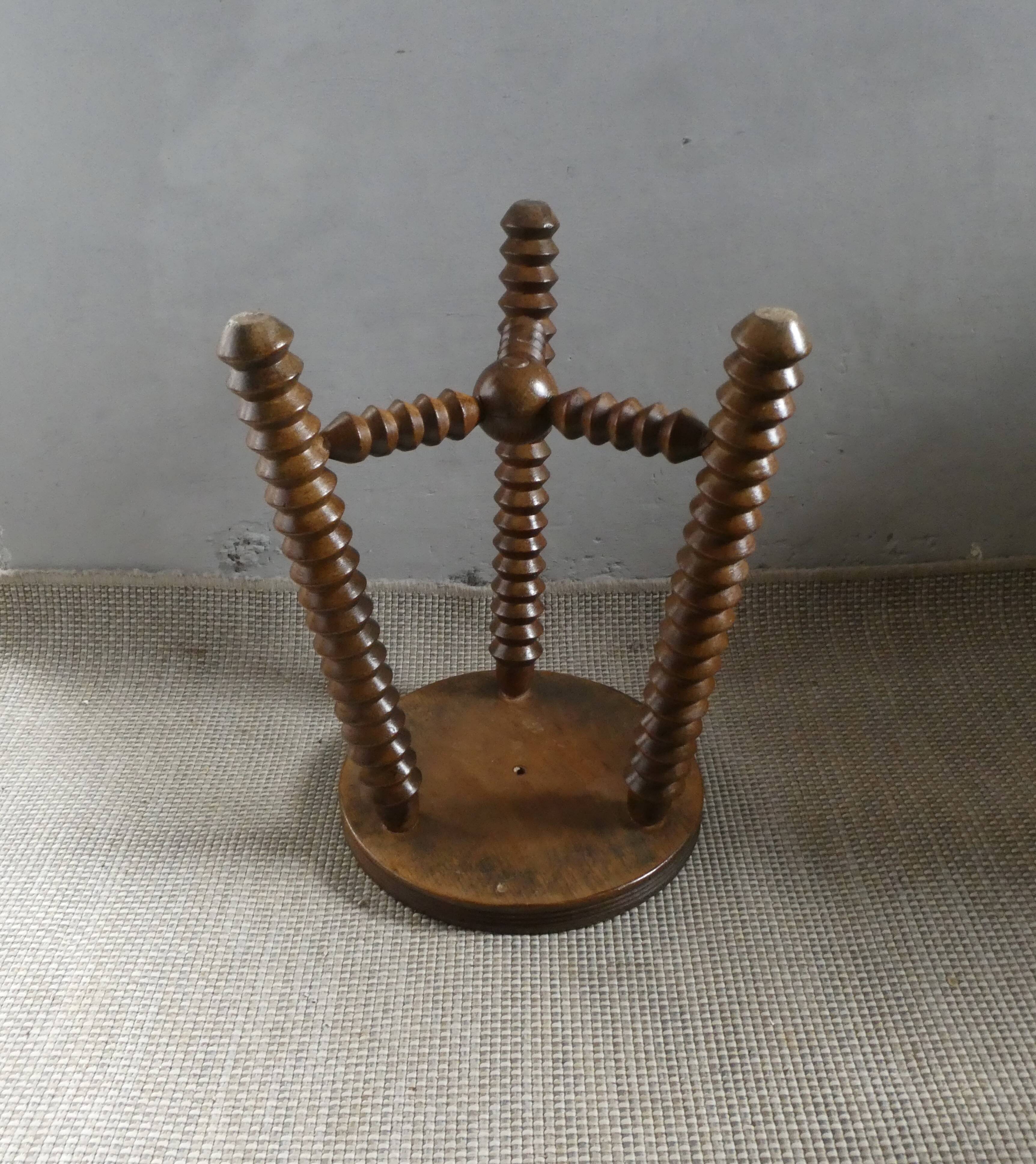 Tripod stool, with carved legs, around 1940