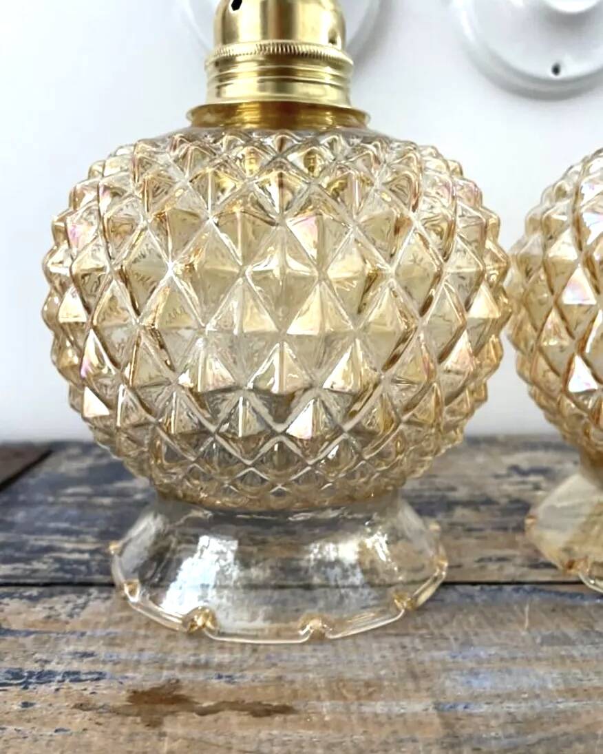 Pair of golden globe wall lights