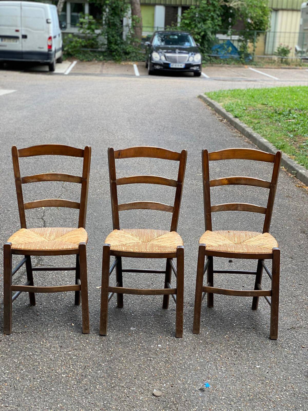 3 solid wood and straw chairs