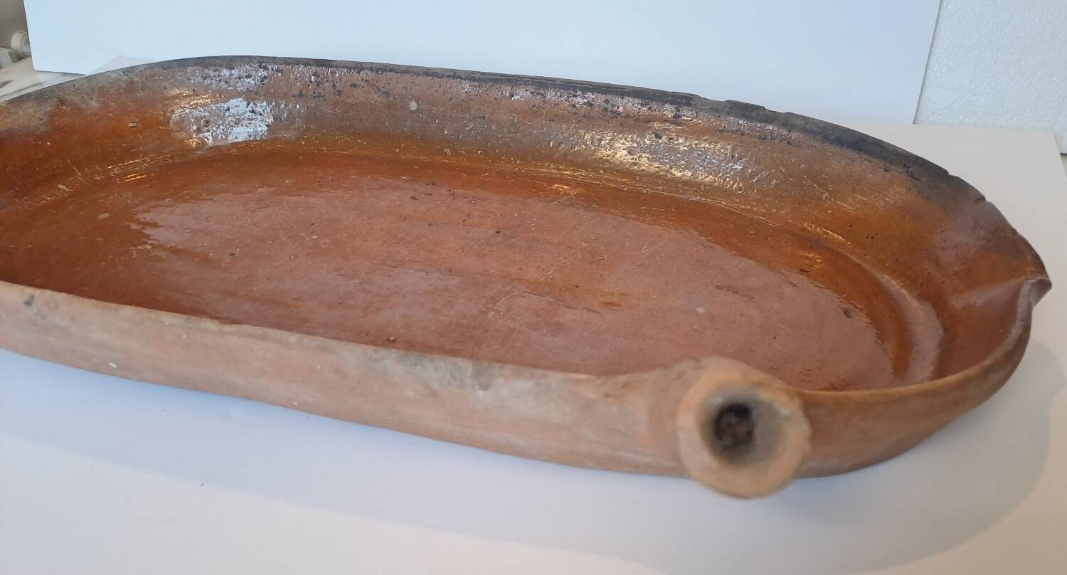 Old glazed terracotta frying pan from the 19th century.