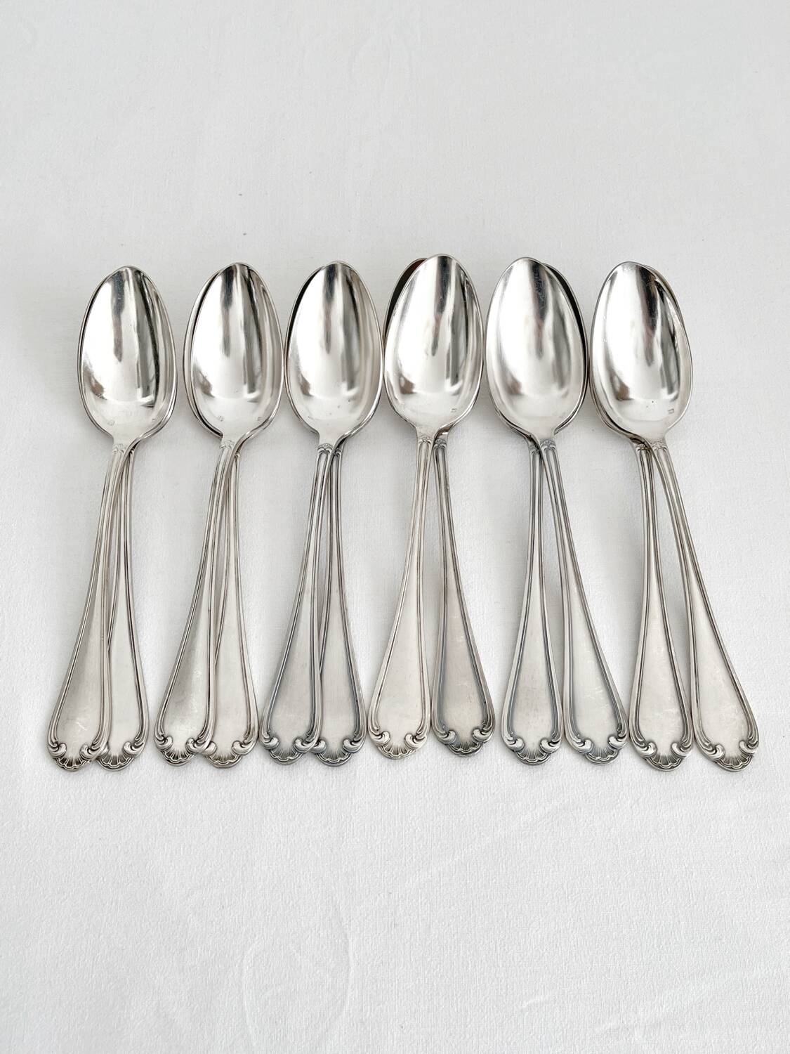 12 antique silver plated shell soup spoons