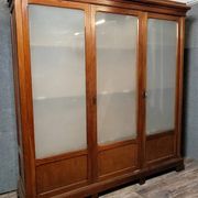Large pine bookcase with three doors, fitted with frosted glass.