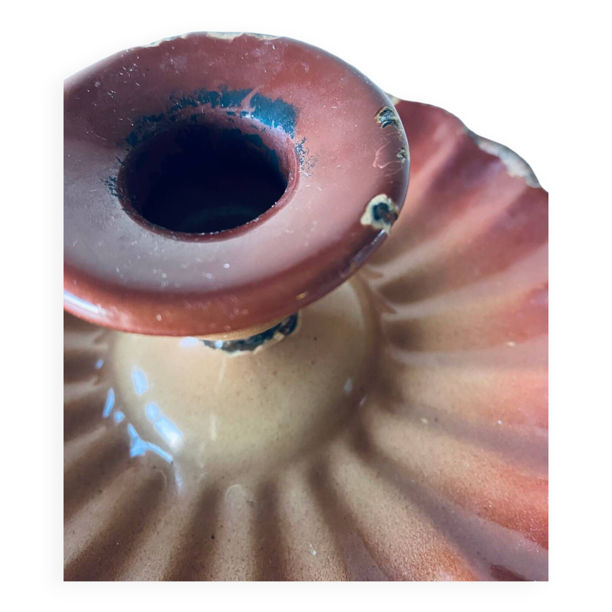 Old candle holder in brown enameled metal