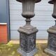 Large antique cast iron vases on pedestal