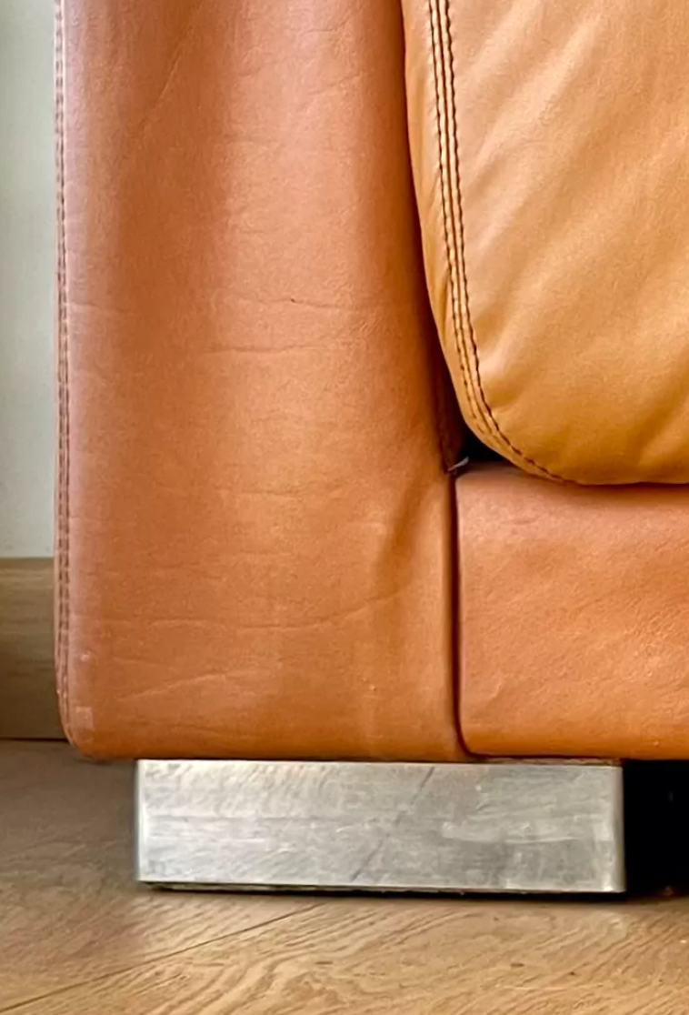 Pair of vintage armchairs Gérard Guermonprez tawny leather and stainless steel, France 1970