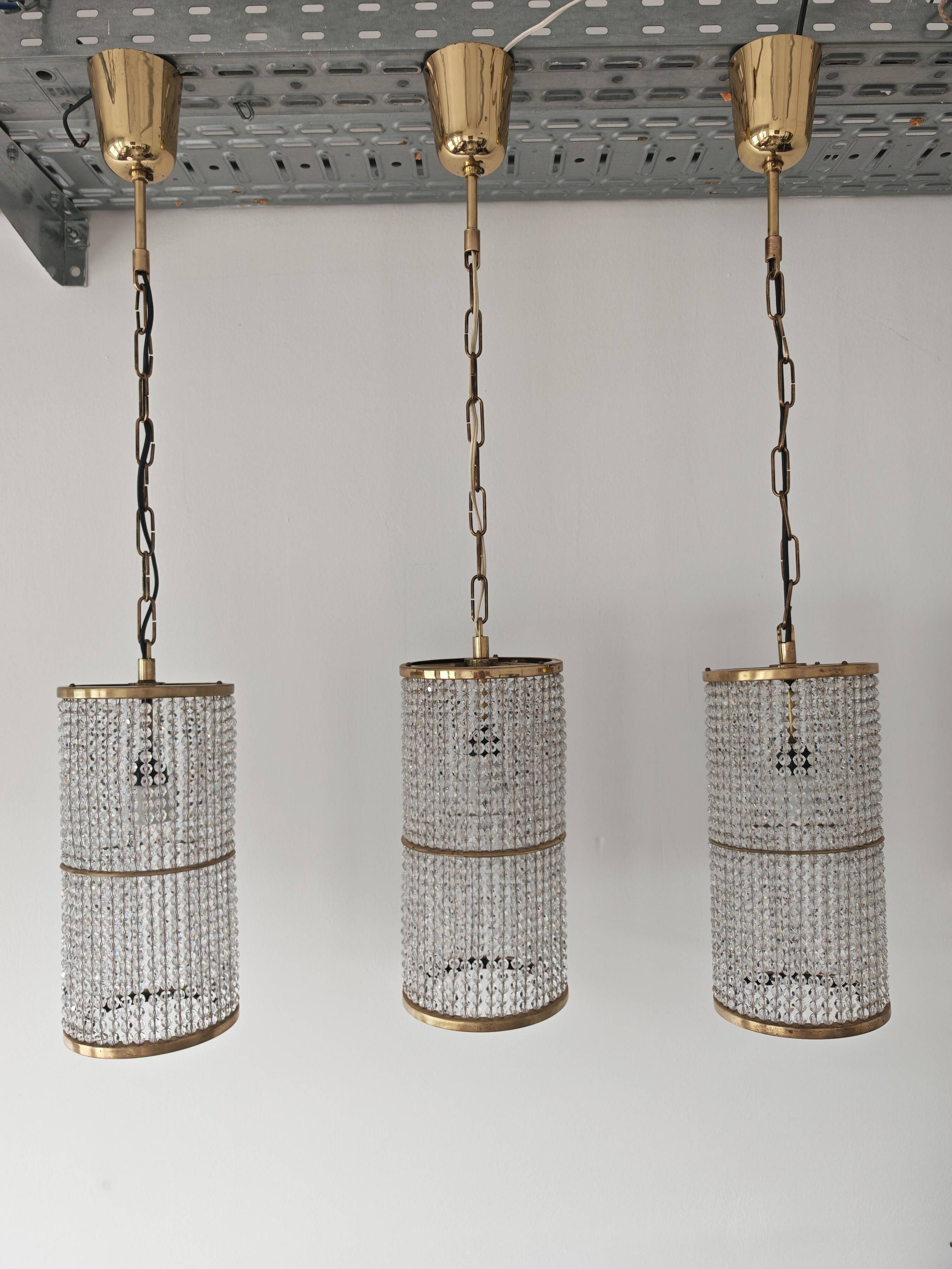 Set of 3 cylindrical crystal chandeliers in mid-century modern style attributed to Lobmeyr.