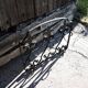 Old wrought iron fleur-de-lis fire screen