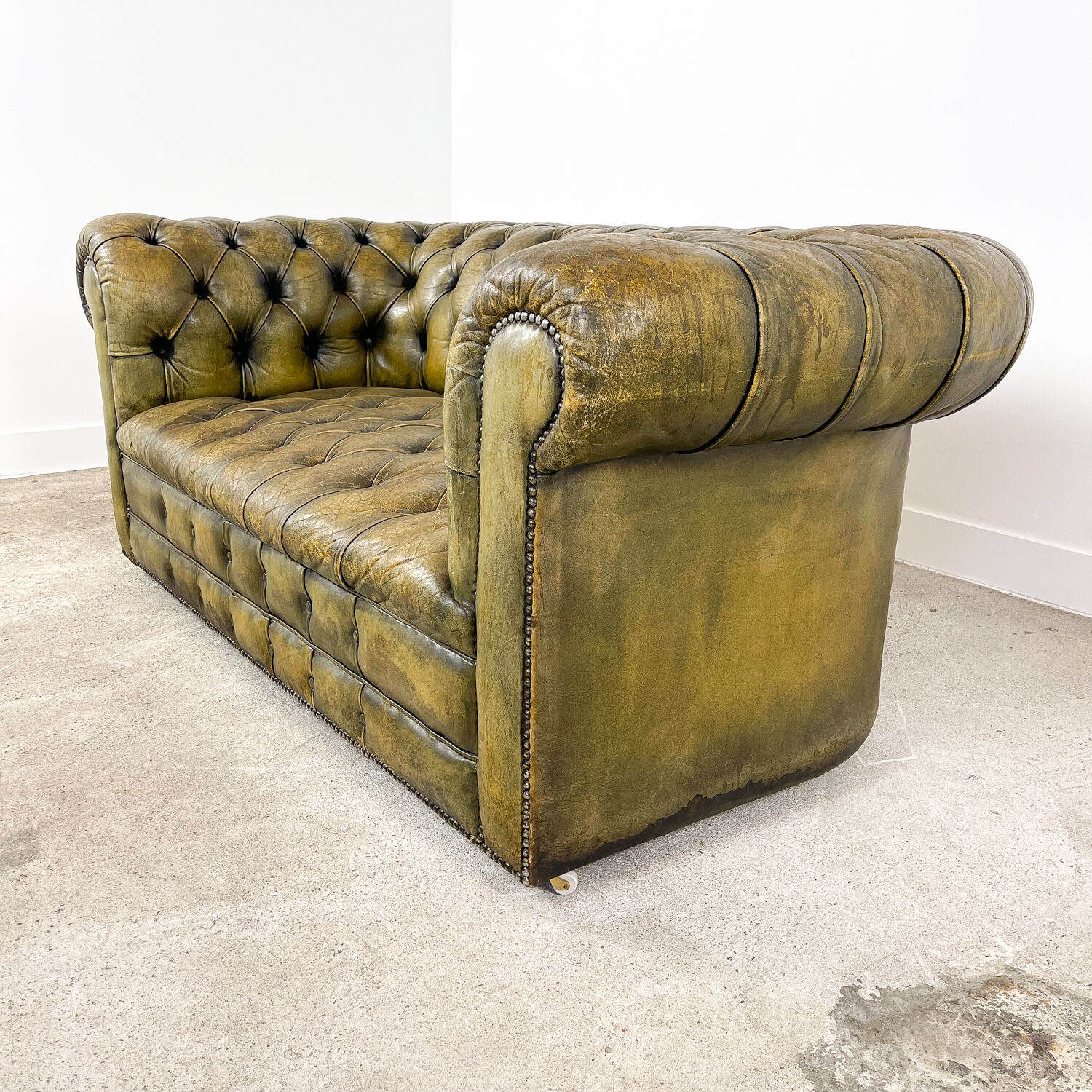 Old vintage leather chesterfield sofa