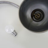 Old industrial articulated lamp with vice. Year 50