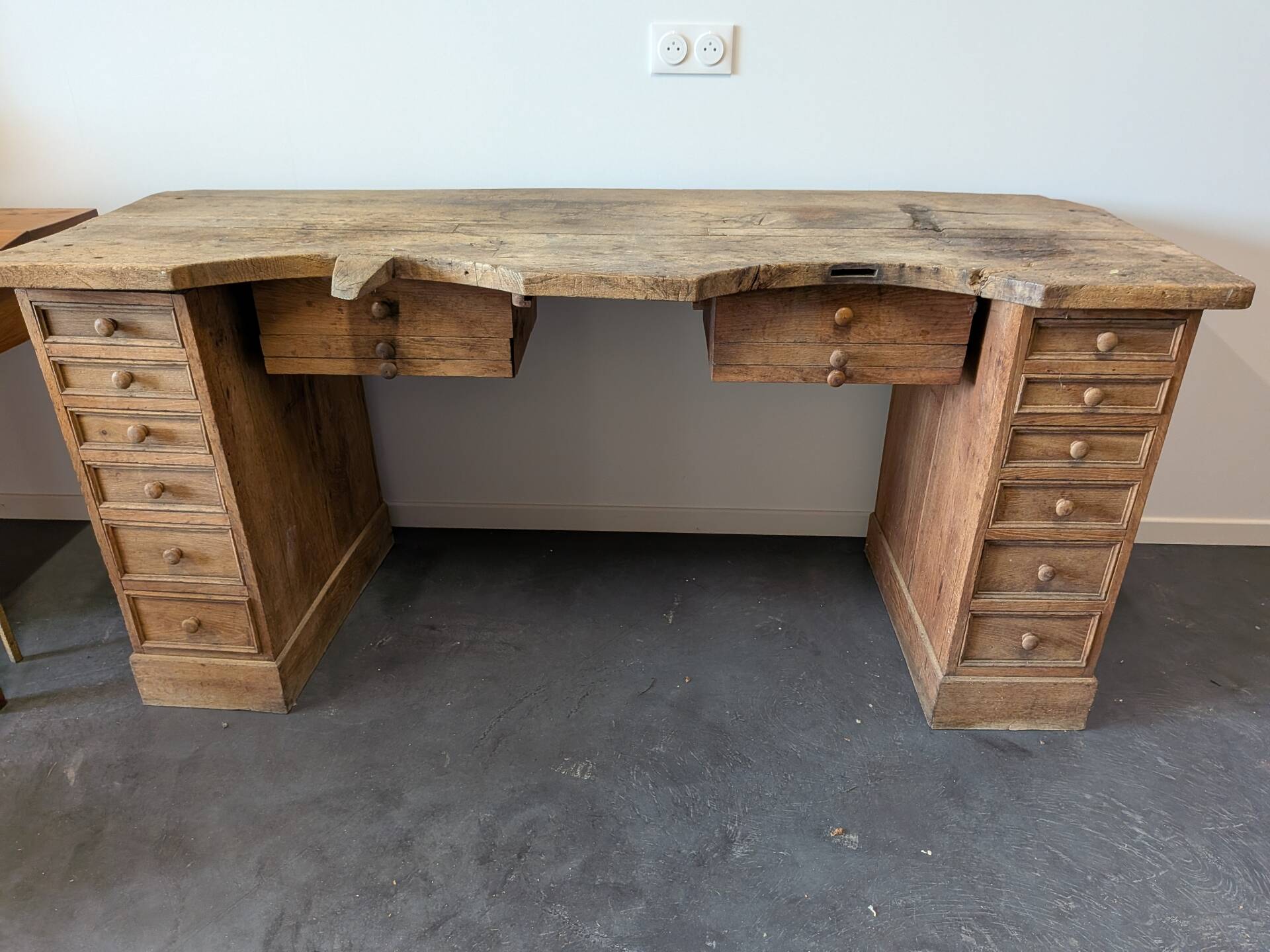 Double jeweller's workbench in solid oak, 18 drawers, early 20th century.