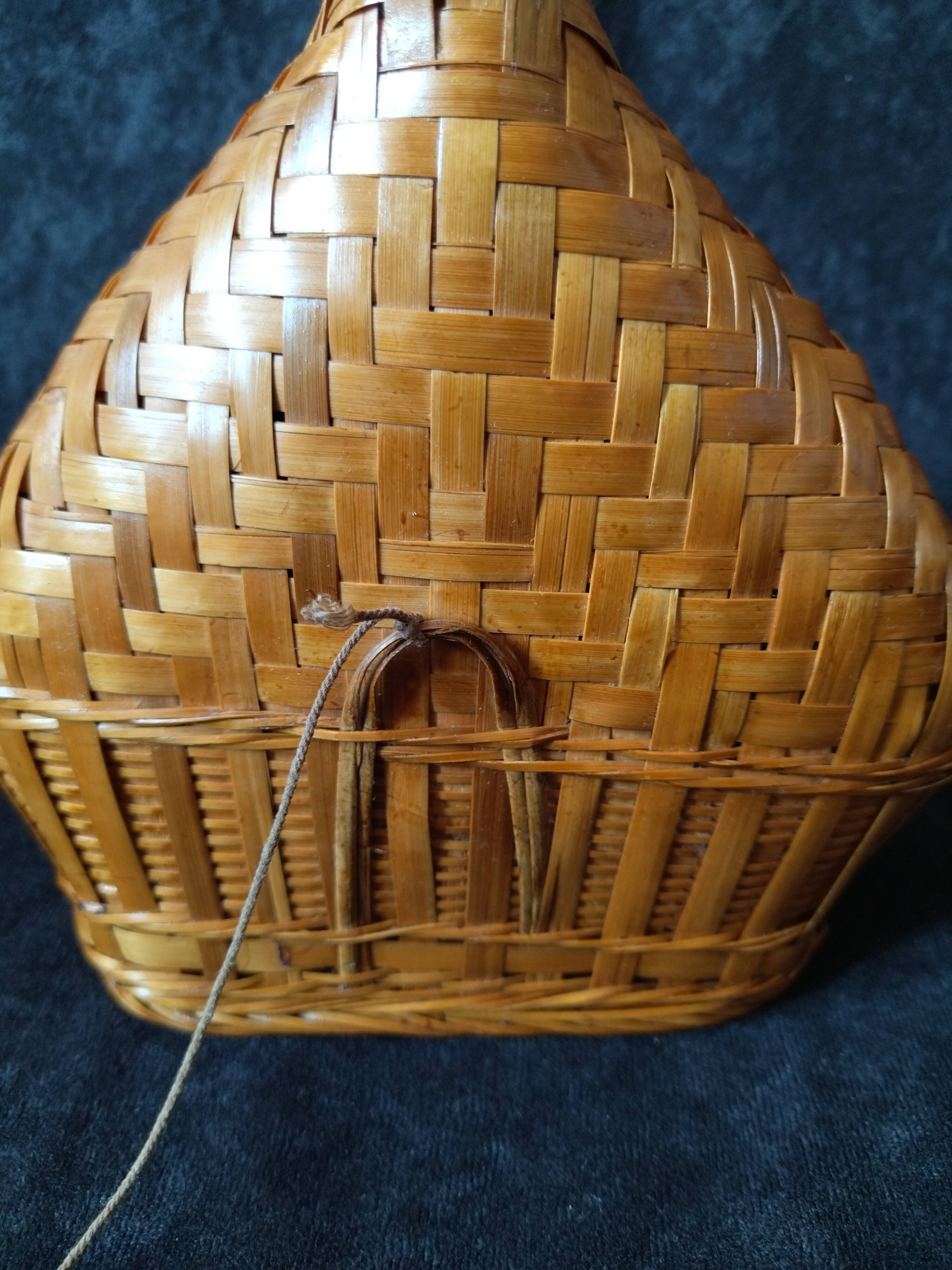 Vintage wicker and braided bamboo bottle