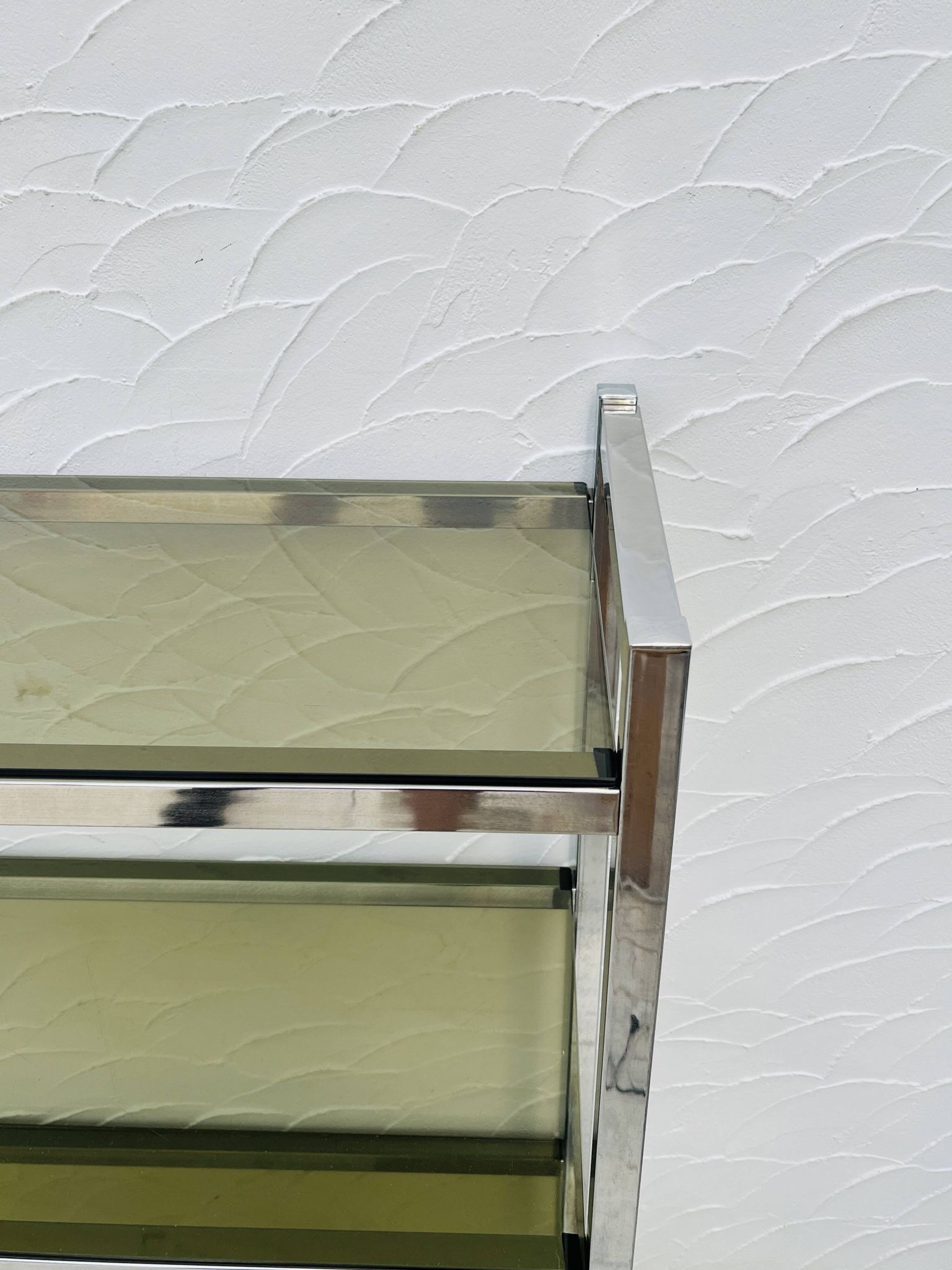 Chrome and smoked glass shelf in Italian 1970s style.