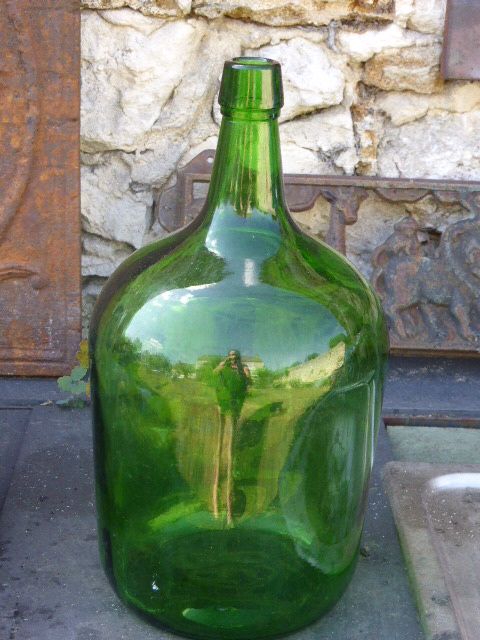 Dark green glass demijohn, vintage