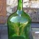 Dark green glass demijohn, vintage