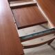 Scandinavian oval teak table with integrated extensions, 1960s, as good as new.