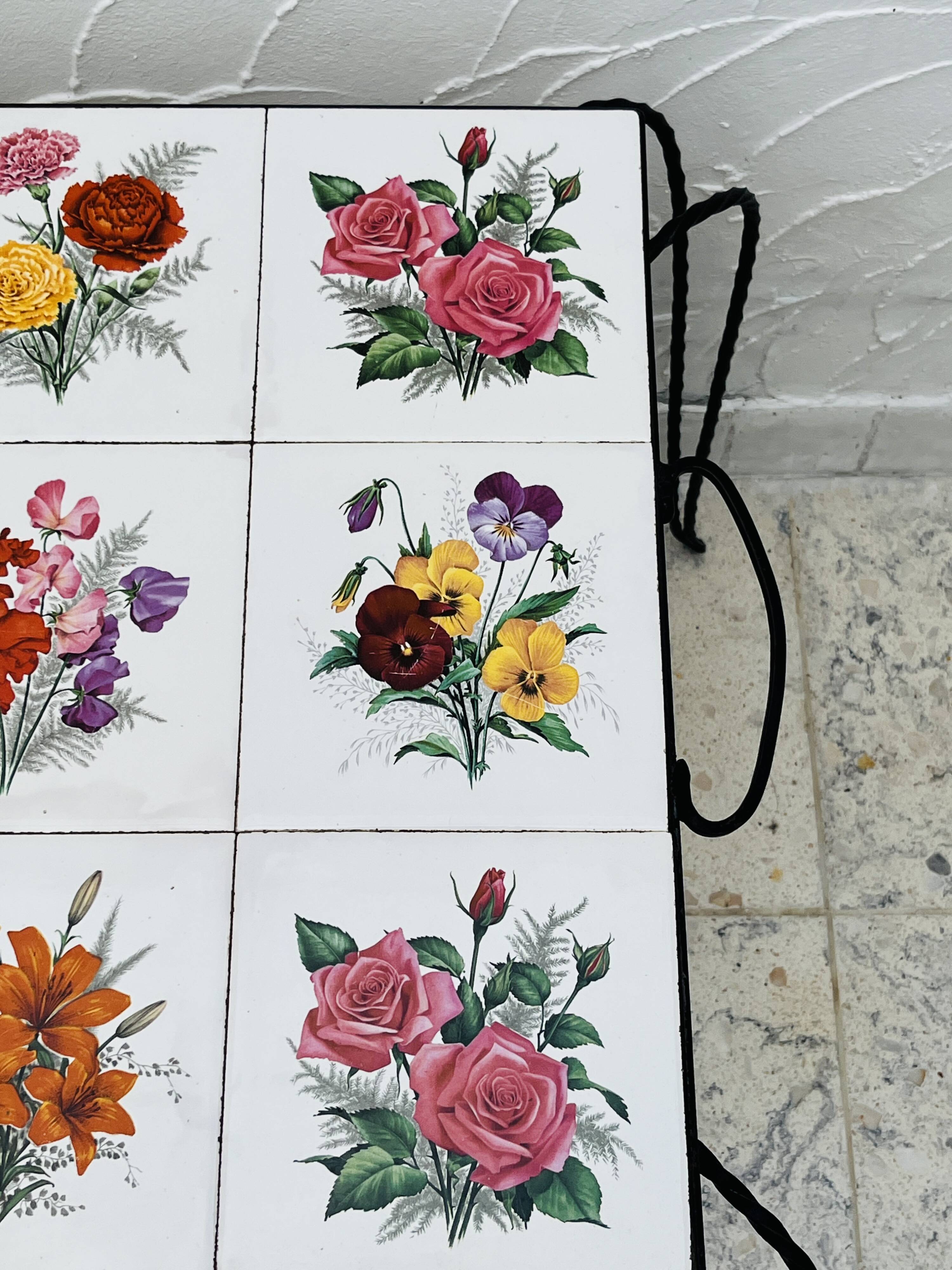 Vintage coffee table in wrought iron with floral tiles.