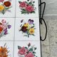 Vintage coffee table in wrought iron with floral tiles.