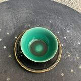 Coffee service composed of 5 cups and saucers in black earthenware and different colored interiors