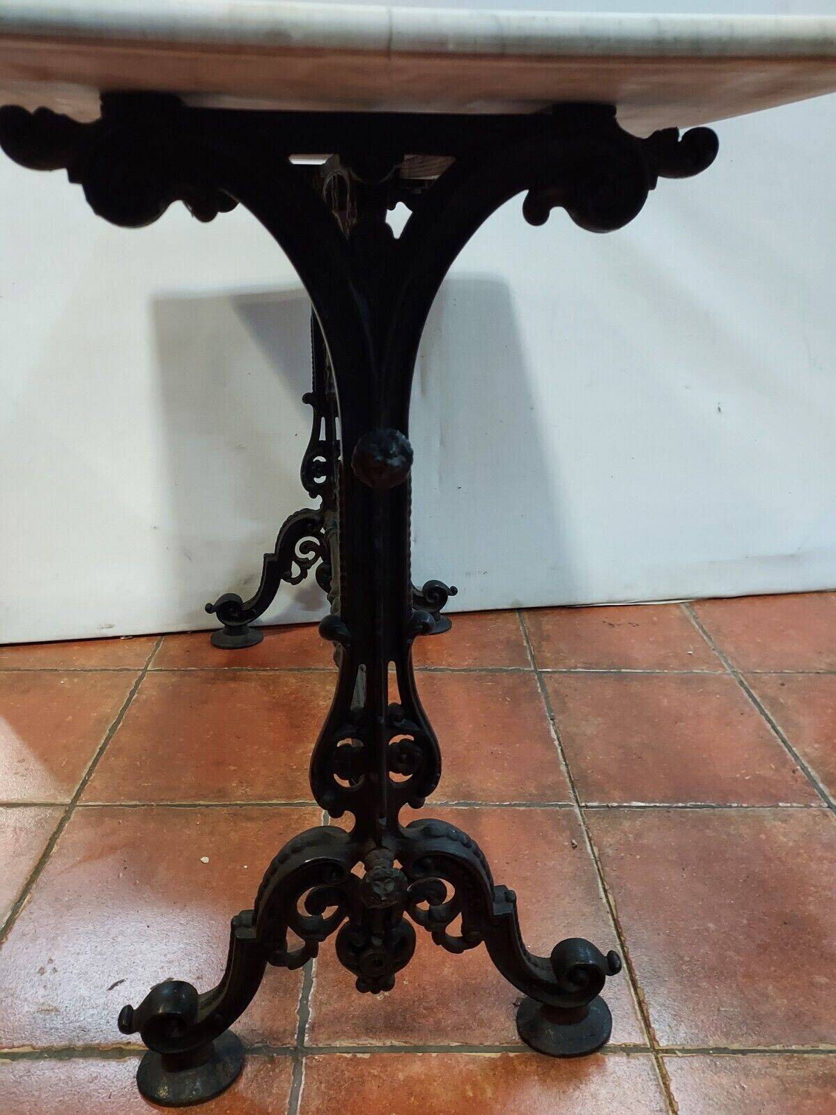 bistro table with cast iron base and marble top