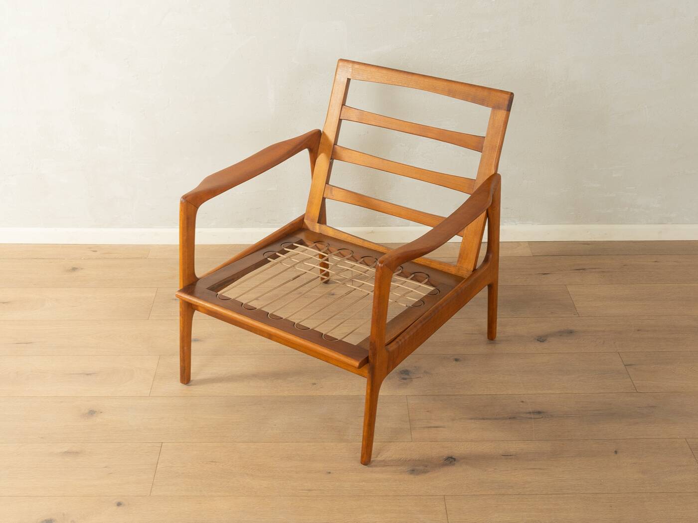 Elegant mid-century armchair from the 1960s with cream-white upholstery