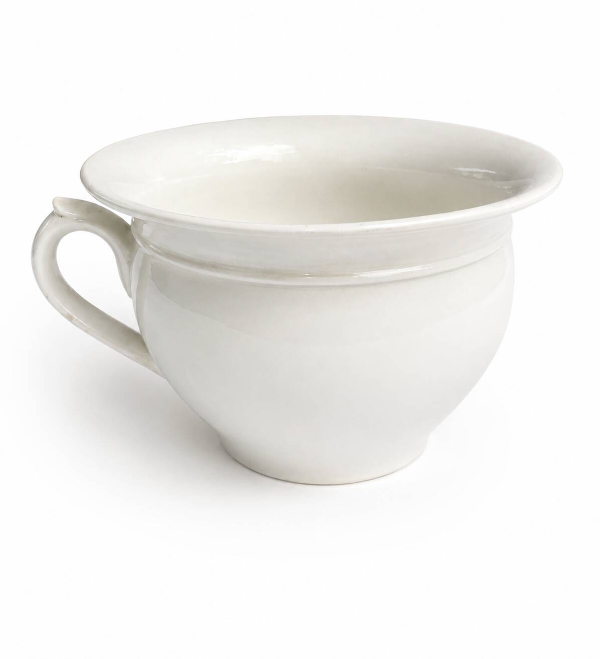 Old Digoin chamber pot in white earthenware – repurposed as a dice bowl.